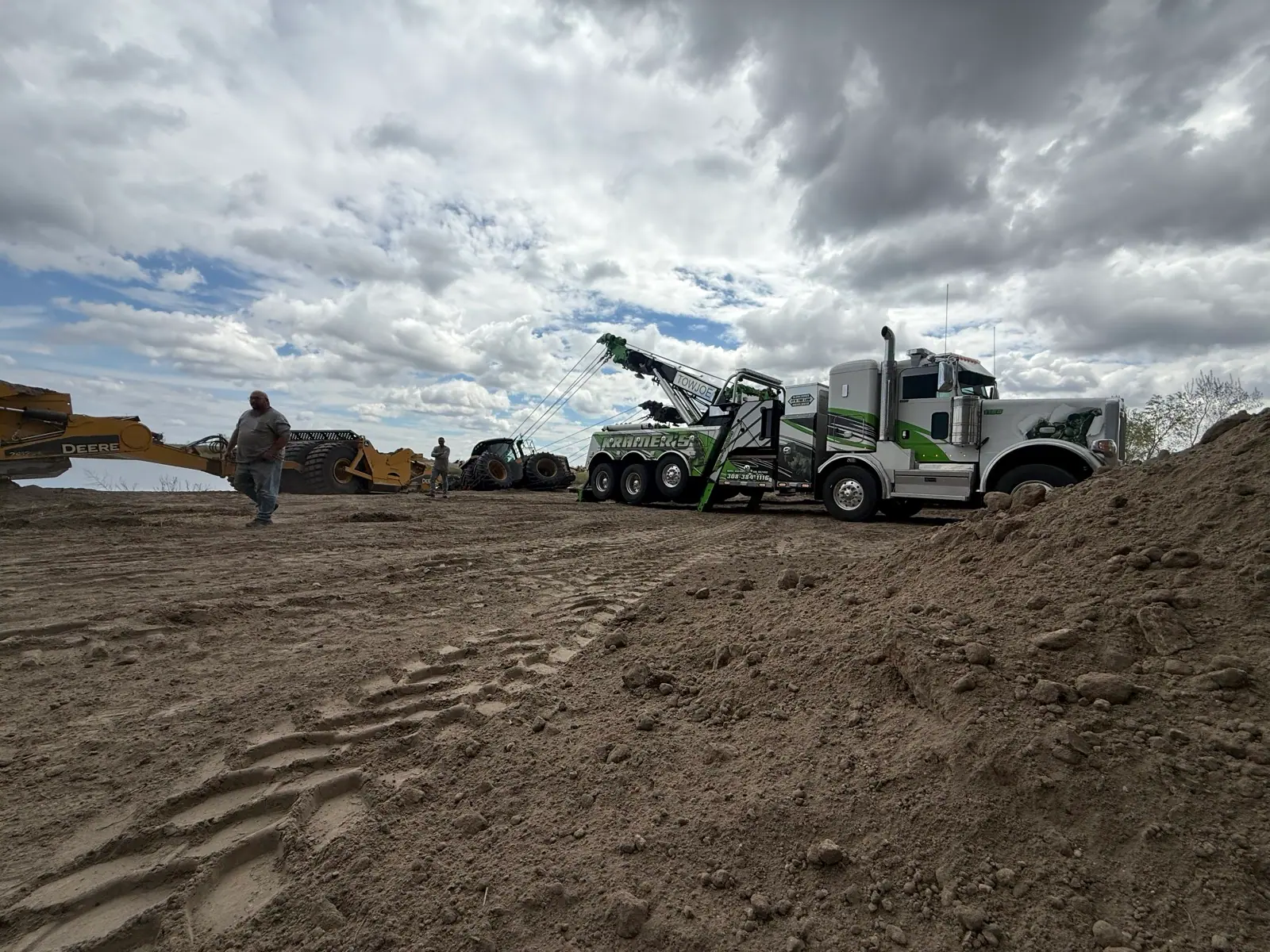 Heavy wreckers working an off-road recovery in a field