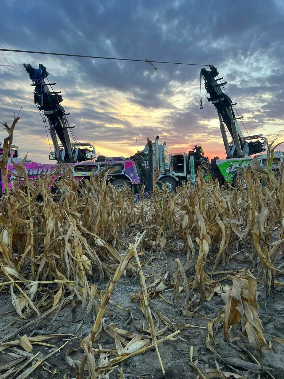 Two Kramer's rotators working a recovery in a cornfield at dusk